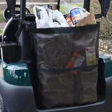 Black mesh storage bag filled with groceries attached to a golf cart.