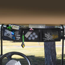 Golf cart storage bag with various items including golf balls, a lure, and tools.