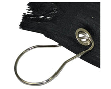 Metal TOWEL  hook on a black fabric background