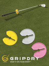 GripDry golf shaft grip devices on a green background with the GripDry logo.