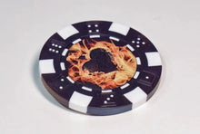 Poker chip with a black heart and flames design on a white background