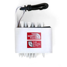 Golf tee holder with 'THE NORTH FACE AND SOUTH BUTT' text on a white background