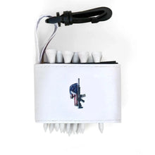 Golf tee holder with 'SKULL AMERICAN FLAG M-16 GUN' text on a white background