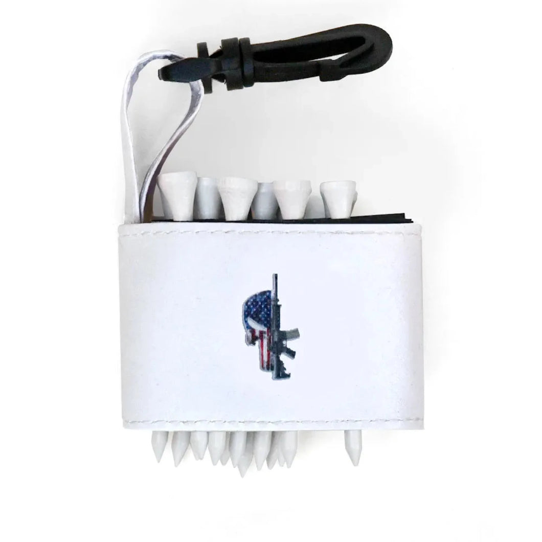 Golf tee holder with 'SKULL AMERICAN FLAG M-16 GUN' text on a white background 